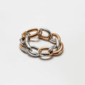 Two-tone chain bracelet with interlinked gold and silver links on a white background